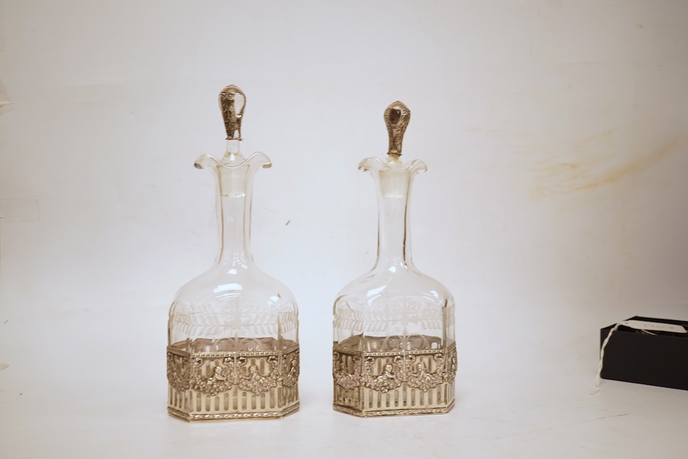 A pair of Hanau silver mounted moulded glass decanters and stoppers, by Berthold Muller, import marks for Glasgow, 1900/1901, 24cm, a.f.